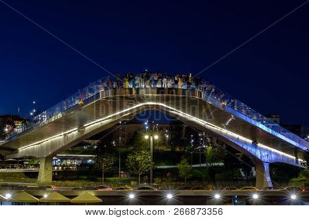 Moscow - 10 August 2018: Night View On Soaring Bridge With People In Zaryadye Park.