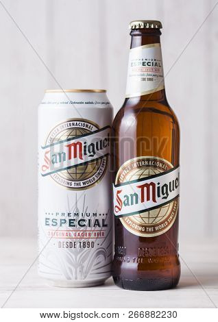 London, Uk - April 27, 2018: Bottle And Aluminium Can Of San Miguel Lager Beer On Wooden Background.