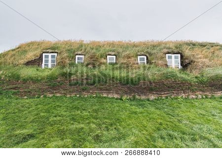 Vermahlid, Iceland - August 2018: Traditional Icelandic Turf Houses Houses With Grass On Roof In Gla