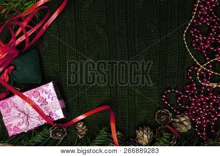 Pink Gift Box, Green Gift Bag With A Cones And Branch Background. Christmas Background. Top View. Sp