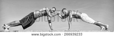 Push Ups Challenge. Men Motivated Workout Together. Sportsmen Improves His Strength By Push Up Exerc