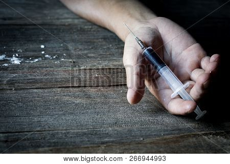 Drug Abuse Concept, Overdose Male Drug Addict Hand, Drugs Narcotic Syringe In Hand On The Floor