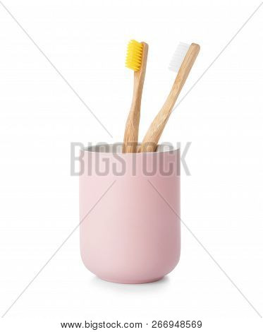 Bamboo Toothbrushes In Holder On White Background. Dental Care
