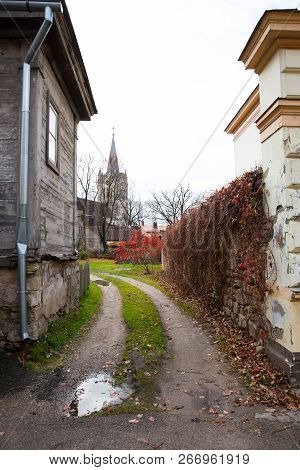 Old Church And City Streets At Autumn. Leafs, Nature And Architecture. Historic Buildings. Travel Ph