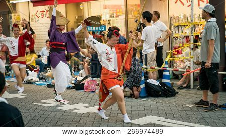 Tokyo, Japan - August 2018: Japanese Performers Dancing Traditional Awaodori Dance In The Famous Koe