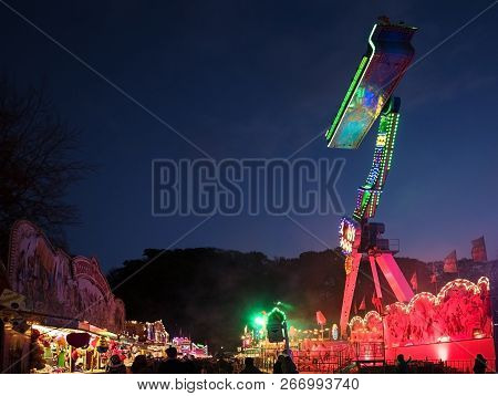 Moelln, Germany, November 1, 2018: Funfair Gravity Ride At The Autumn Market, High Iso Night Shot, A
