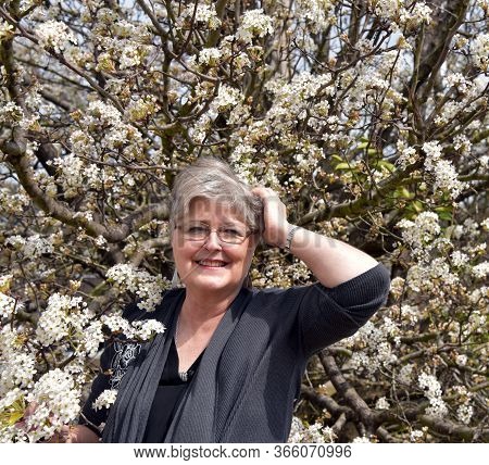 Spring And Wind Blowing Mature Woman's Hair