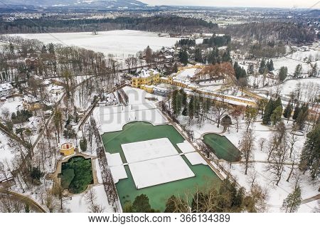 Aerial View Of Schloss Hellbrunn Covered In Snow Near Salzburg Outskirts In Winter Time
