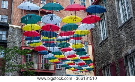 Famous Place In The Old Quebec City With Colored Umbrellas Above A Pedestrian Street