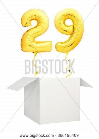Golden Number Twenty Nine Balloon Flying Out Of Blank White Box Isolated On White Background