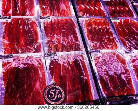 Barcelona, Catalonia, Spain - April 15, 2015: Famous Iberico meat products produced from black Iberian pigs in La Boqueria Market next to La Rambla.