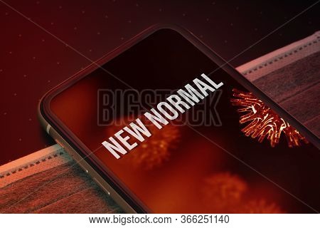 New Normal After Covid 19 Outbreak Background Concept. The New Normal Message On The Smartphone With