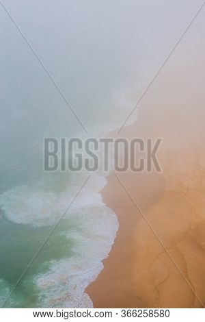 Sea And Sandy Beach In Dense Fog, Autumn Day