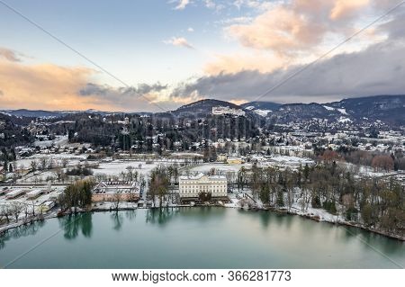 Aerial Drone Shot View Of Leopoldskroner Lake Southwest Of Outskirts Of Salzburg During Winter