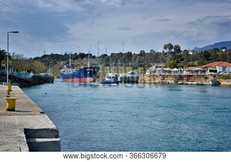 The Corinth Canal connects the Gulf of Corinth with the Saronic Gulf in the Aegean Sea in Greece. It cuts through the narrow Isthmus of Corinth and separates the Peloponnese from the Greek mainland