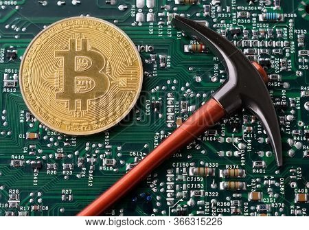 Bitcoin And Pickaxe On Background Of Micro Schemes, Cryptocurrency Concept