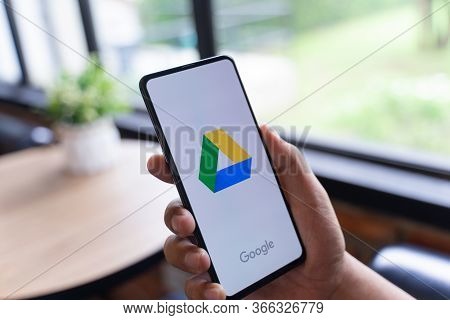 Chiang Mai, Thailand - Aug.24,2019:  Man Holding Xiaomi Mi Mix 3 With Dropbox On Screen.dropbox Is A