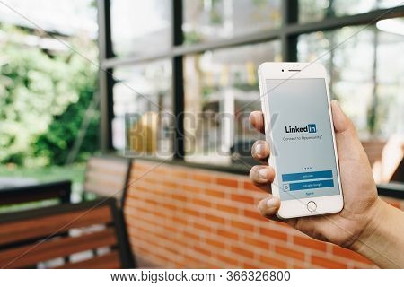 Chiang Mai, Thailand - Feb.17,2020: Man Holding Apple Iphone 8 Pius With Linkedin Application On The