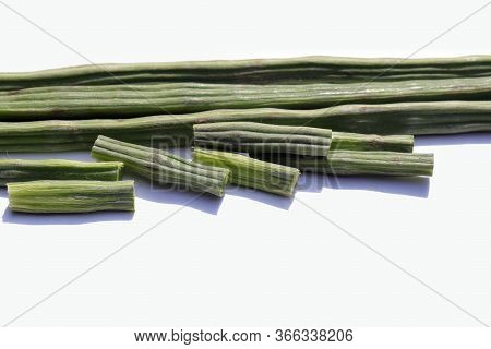Drumstick Pods Vegetable Or Moringa Oleifera With Selective Focus Isolated On White Background