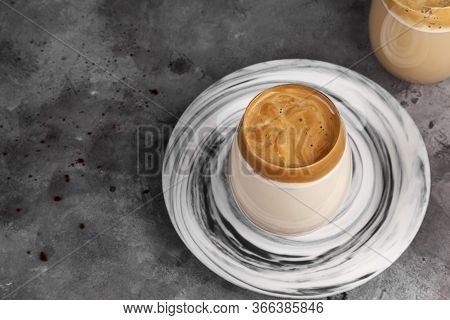 Popular Drink Korean Dargon Coffee Made Of Instant Coffee, Sugar, Hot Water And Milk In Glass On Gre