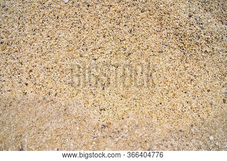 Macro Close Up Of Coarse Rice-sized Multi-coloured Wet Shiny Sand Grains And Gravel Texture, Top Vie