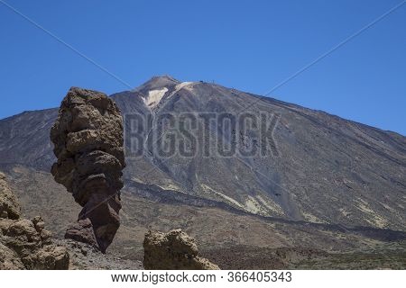 Panoramic View Of Unique Roque Cinchado Unique Rock Formation With Famous Pico Del Teide Mountain Vo