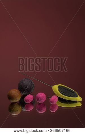 Bright Green, Red Boilies, Fishing Baits For Carp Isolated On Dark Background.
