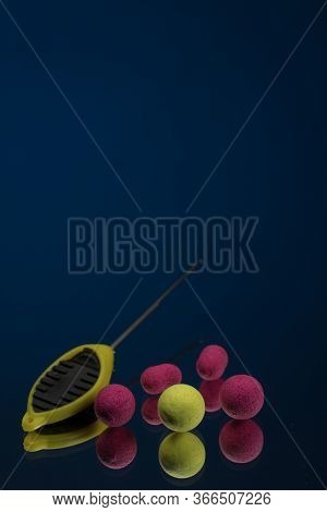 Bright Green, Red Boilies, Fishing Baits For Carp Isolated On Dark Background.