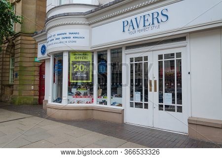 Llandudno, Uk: Aug 27, 2019: A Pavers Footwear Store With Window Banners Advertising A Sale. The Sto