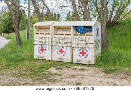 Straszyn, Poland - May 15, 2020: Polish Red Cross Containers For Clothes.