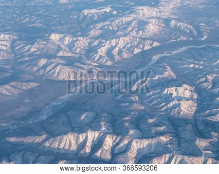 Distant Frozen Mountains Seen From High N The Sky.