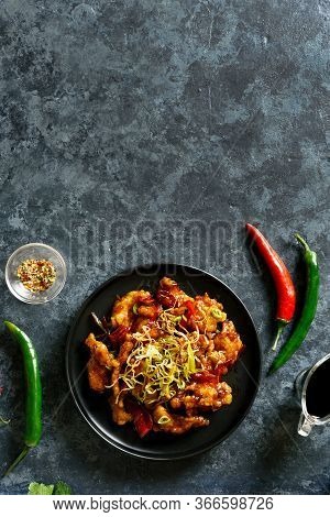 Spicy Garlic Fried Chicken (kkanpunggi). Asian Chicken In Sweet And Sour Sauce On Plate Over Dark St