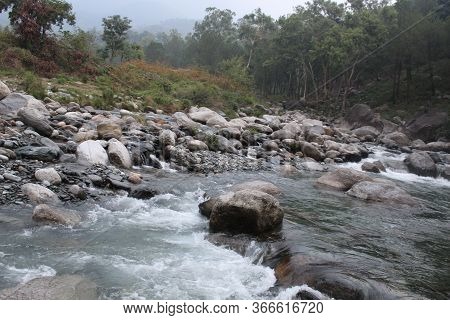 Beautiful View Of Flowing Water Between Stones In Uttarakhand, India
