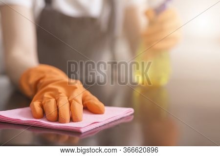 Residential Cleaning Service Concept. Closeup Of Housemaids Hand Cleans Dust From Table With Rag, Se