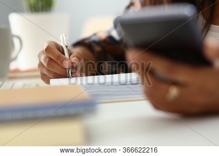 African Woman Hold Modern Smartfone In Hand And Make Note Closeup. Telework Apps Concept.