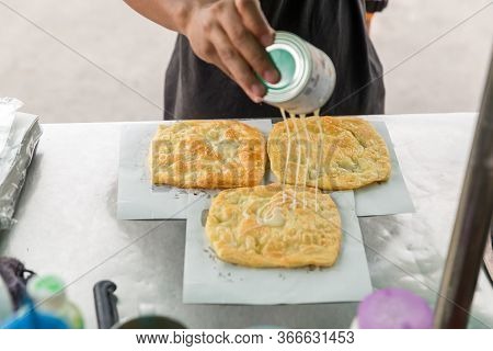 Roti Making, Roti Thresh Flour By Roti Maker With Oil. Indian Traditional Street Food. Thai Pancake 