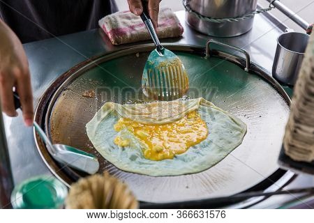 Roti Making, Roti Thresh Flour By Roti Maker With Oil. Indian Traditional Street Food. Thai Pancake 