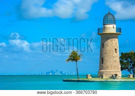Boca Chita Lighthouse And Miami Skyline On Calm Day