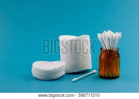 Q-tips, Cotton Swabs, Cotton Pads, Isolated On Bright Blue Background