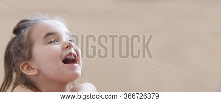 Little Girl With Their Mouths Wide Open. The Child Are Playing. The Concept Of Education , Childhood