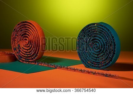 Orange And Green Massage Tape With Rubber And Metal Needles Twisted Into A Circle, On An Orange Surf