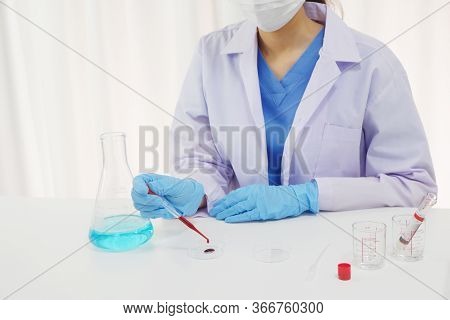 Female Doctor Working In Laboratory For Testing On  Vaccine For Pandermic Covid19.