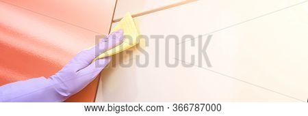 Hand In Protective Glove Clean Kitchen Cabinet. House Cleaning With Rag. Washing And Disinfect Rasta