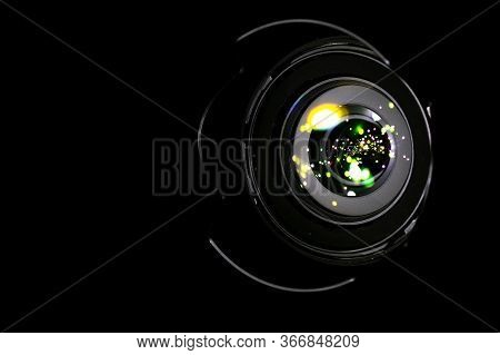 Lense Flare Lights On Shutter. Reflection On Photo, Video Camera On Black Background. Sunlight Abstr
