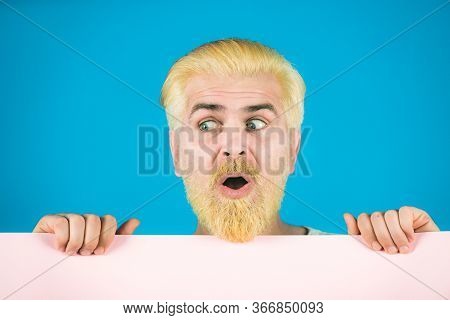 Man Holding A Blank Billboard Isolated On Background. Blank, Empty Paper, Billboard With Copy Space 