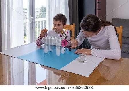 Boy Makes Easy Cow Paper Craft, Mother Helping Her Son To Do Homework, Parents Teaching Kids At Home