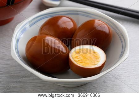 Bowl with whole and half traditional Asian soy sauce eggs, Shoyu tamago  