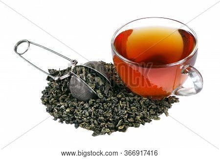 Green Tea Leaves In A Tea Strainer And Cup Of Fresh Tea Isolated On A Whte