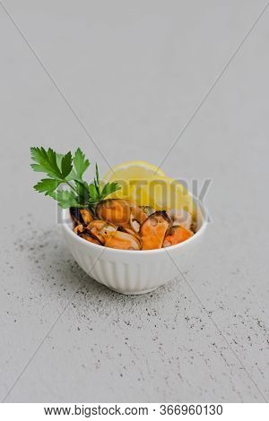 Mussels Without Shell With Lemon Slices In White Ceramic Bowl. Seafood Concept. Vertical Shot. Selec