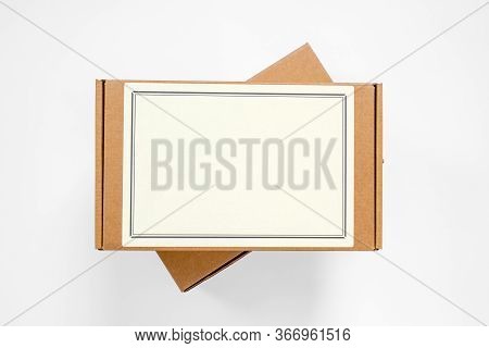 Two Cardboard Boxes For Parcels, One Above The Other, Copy Space For Any Text. Post Delivery Or Cour